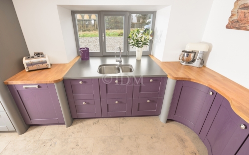 Shaker 95 – Ash – Painted Aubergine with V Groove Joints, Concave Curved Base Unit with S Shaped Doors